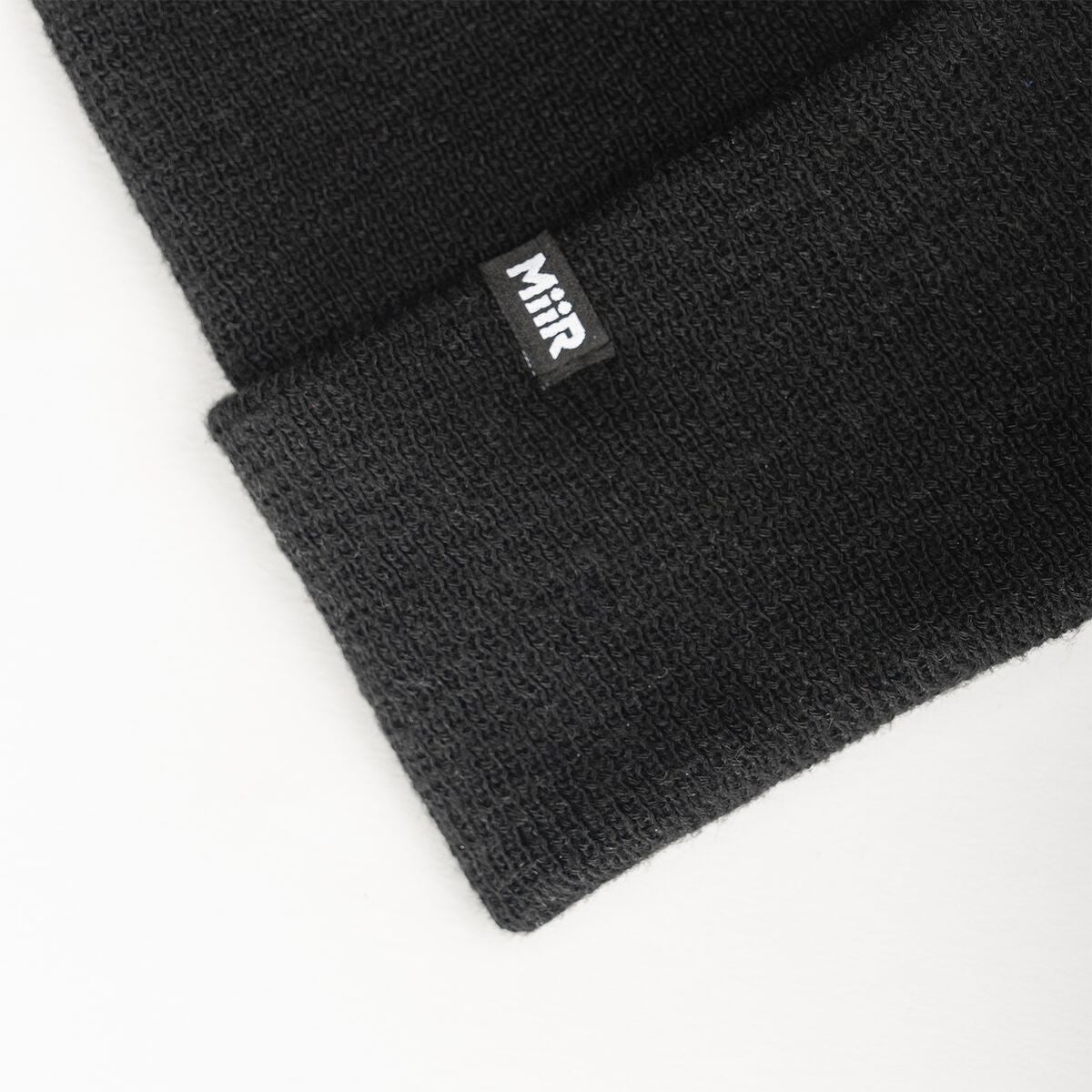 recycled-poly-fine-knit-beanie-i1 WebPDP-RecycledPolyFineKnitBeanie_Studio_TagDetail_Black__BNE005002OS.jpg